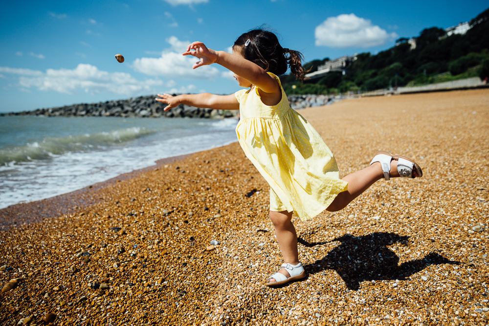 family photography of toddler girl playing at the beach, folkestone, kent