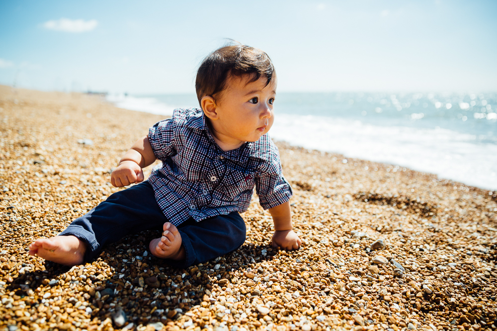 family photography of baby boy sat on beach, folkestone kent