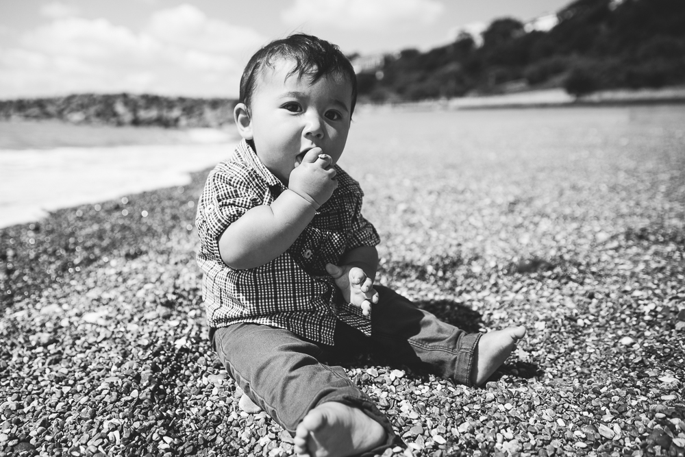 family photography of baby boy sat on beach, folkestone kent