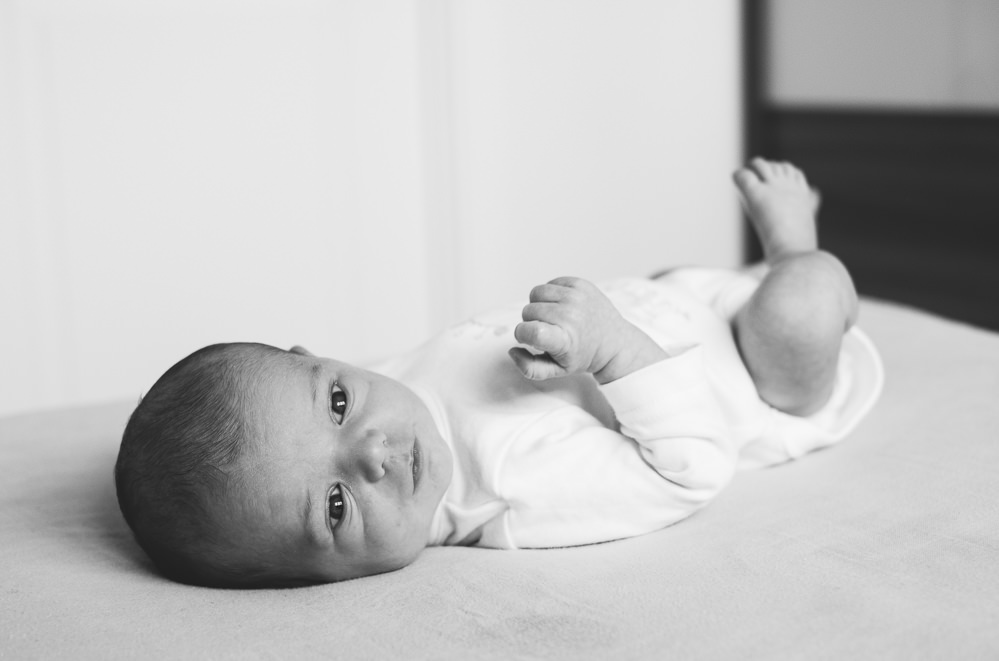 NEWBORN BABY PHOTO SESSION ON BED AT HOME KENT